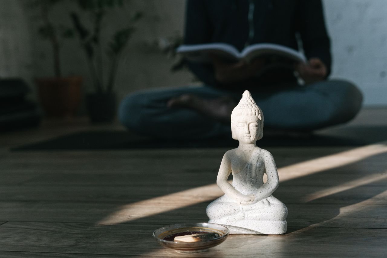 Crafting Captivating Headlines: Your awesome post title goes here A serene scene featuring a Buddha statue and zen meditation setup, perfect for mindfulness themes.